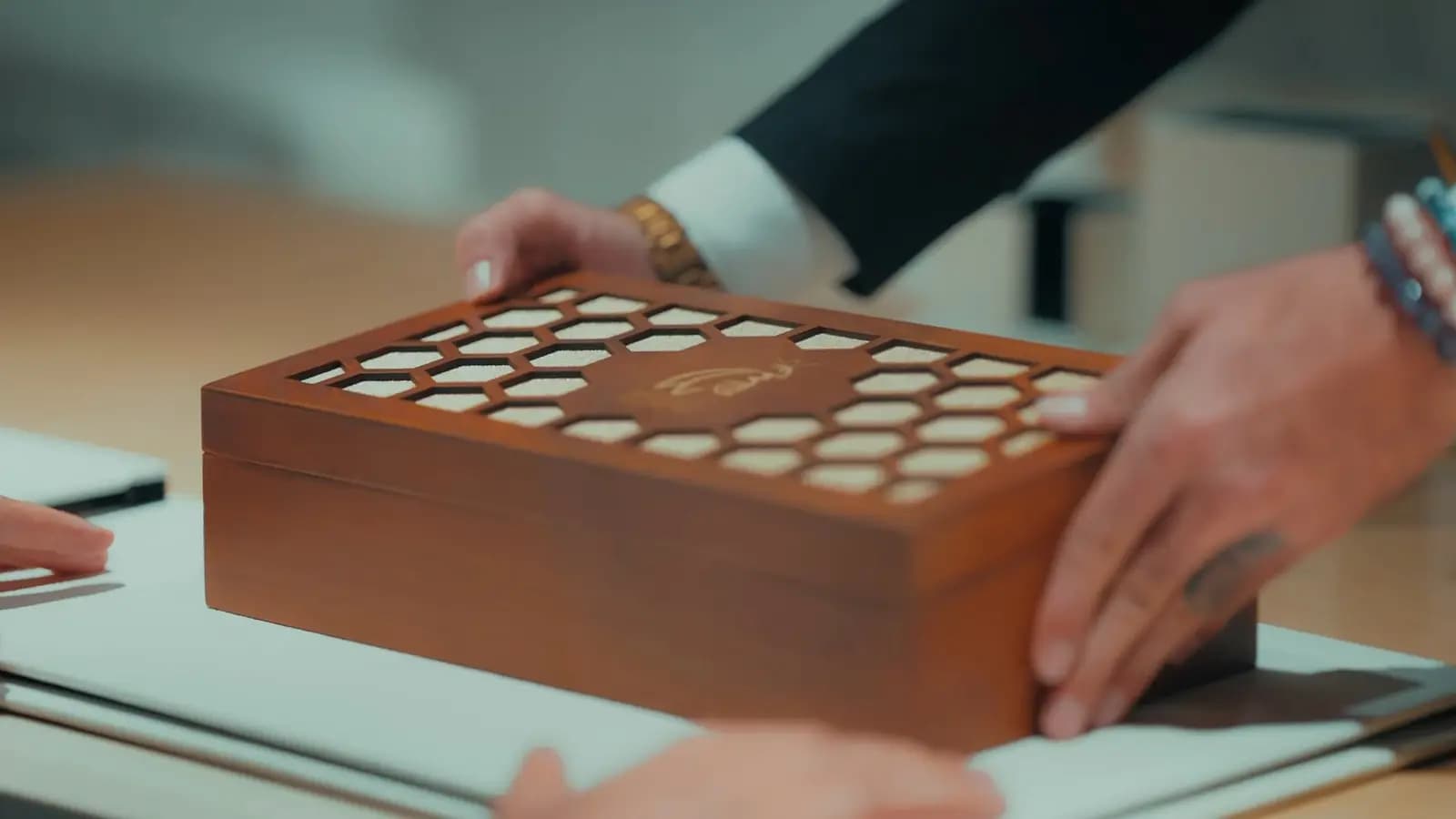 The wooden box, cut like a honeycomb.