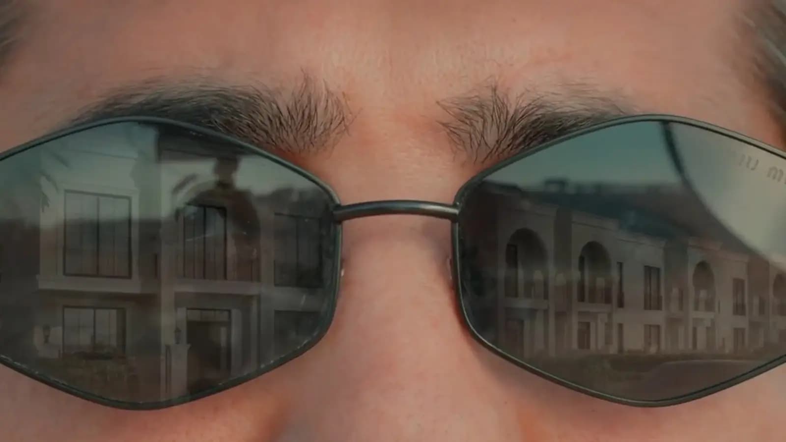 In his sunglasses, the finished homes.