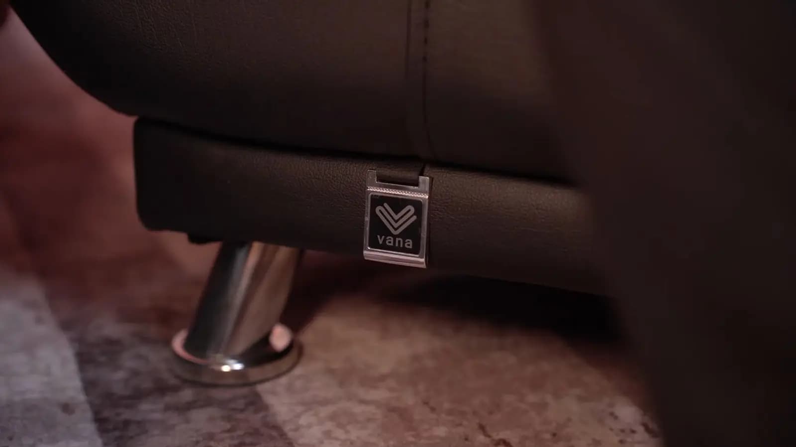 The detail that matters: the Vana tag on the armchair.
